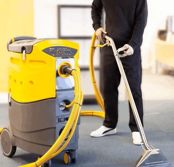 Commercial carpet cleaning in an office with a hot water extraction machine