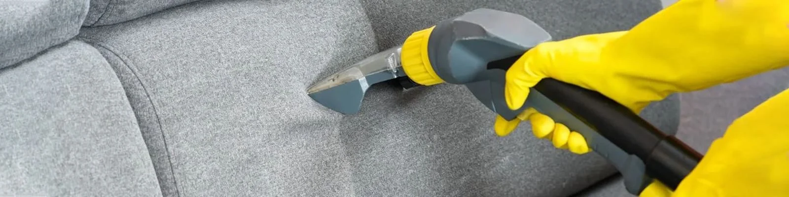 Upholstery stain removal on a grey sofa
